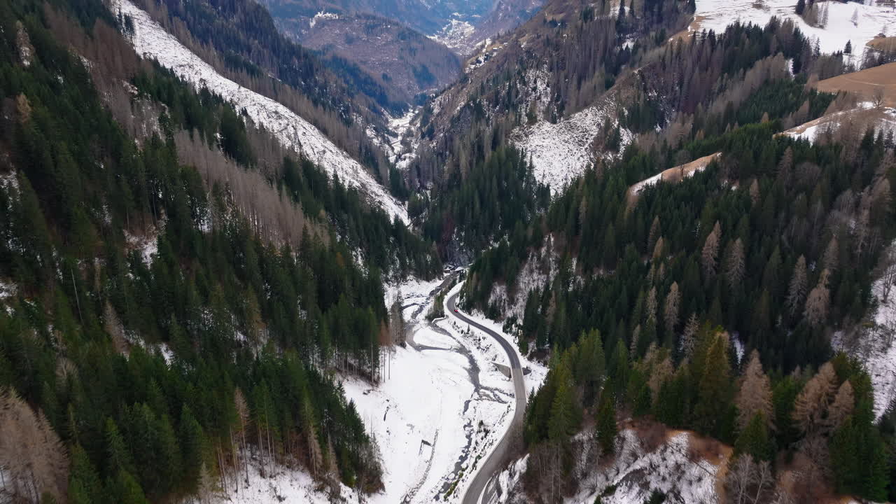 Aerial drone view of snow on the mountains in the Dolomites, Italy