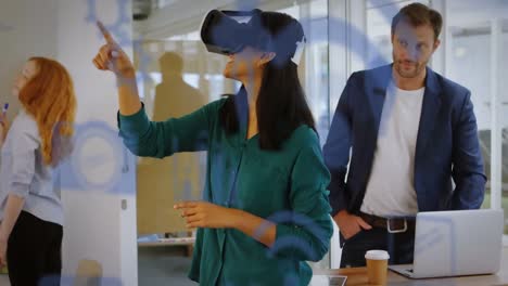 animation of social media icons over diverse colleagues and mixed race woman wearing vr headset