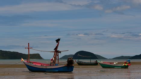 Fishing-Boats-mooring-in-low-tide-are-usually-seen-as-part-of-a-romantic-provincial-seascape-of-Khao-Sam-Roi-Yot-National-Park,-Prachuap-Khiri-Khan,-in-Thailand