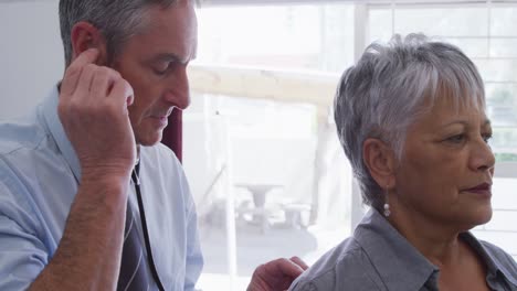 Doctor-examining-a-senior-woman-in-a-retirement-home