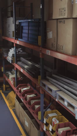 organized warehouse storage with metal shelving and various materials