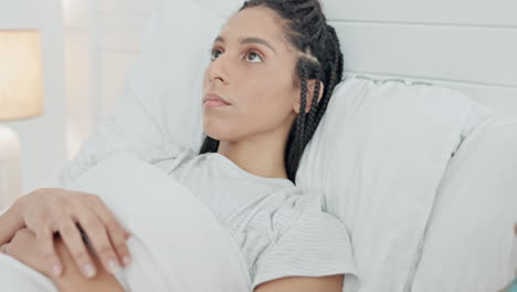 woman, insomnia and thinking in bed