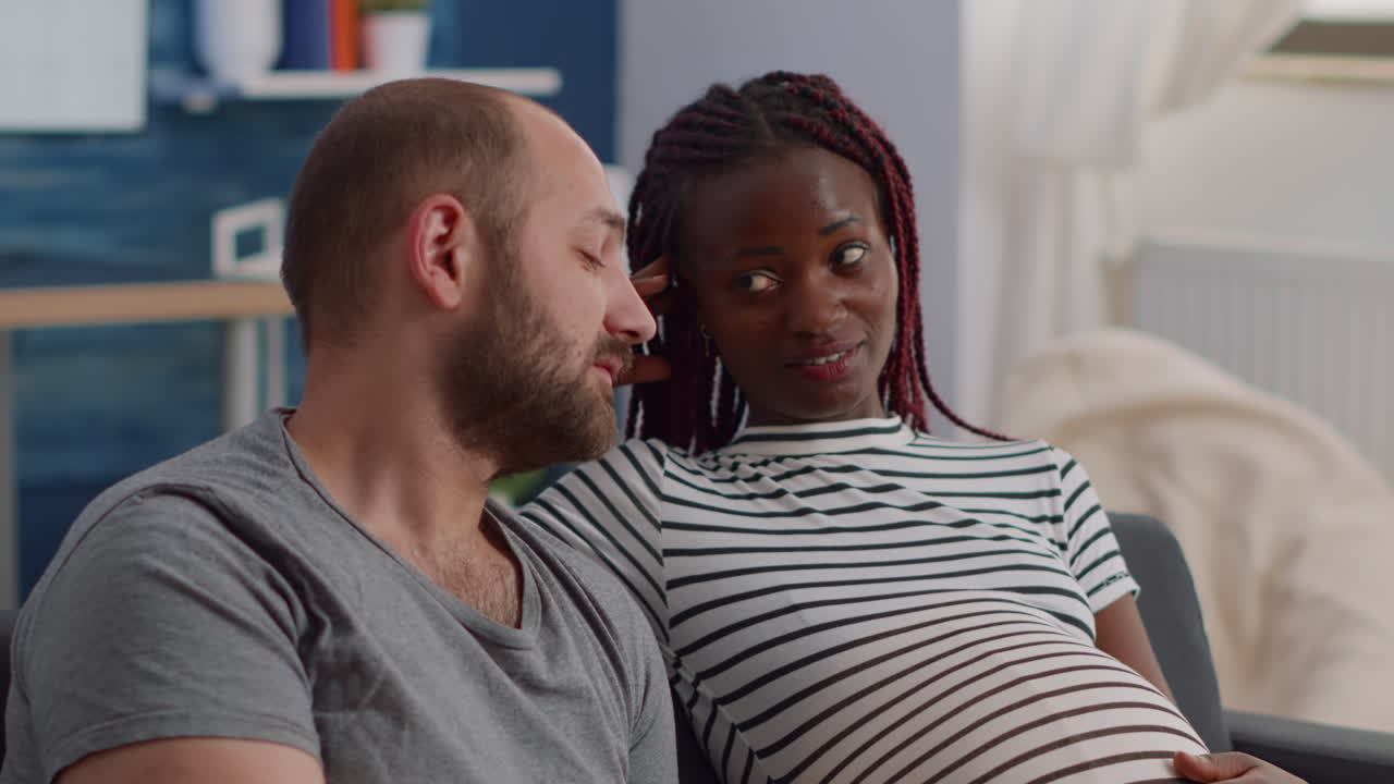 Interracial couple with pregnancy at home