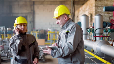 two workers at the factory