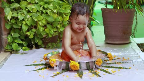 cute toddler baby boy bathing in decorated bathtub at outdoor from unique perspective