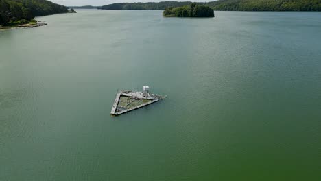 aerial view - meteo station on water of radunskie lake in borucino village poland