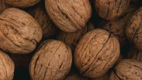 rotating pile of whole walnuts.