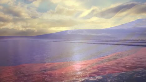 animación de la bandera colombiana ondeando sobre una playa soleada