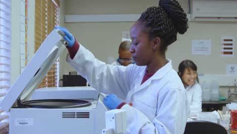 laboratory technician using refrigerated centrifuge machine 4k