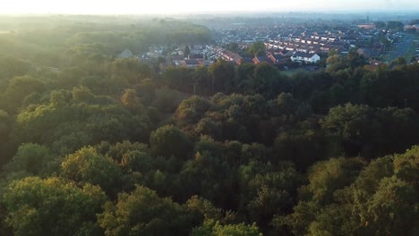 aerial reveal backwards over reservoir on misty frosty sunset