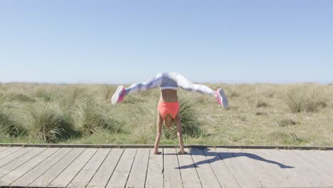 woman standing on on hands