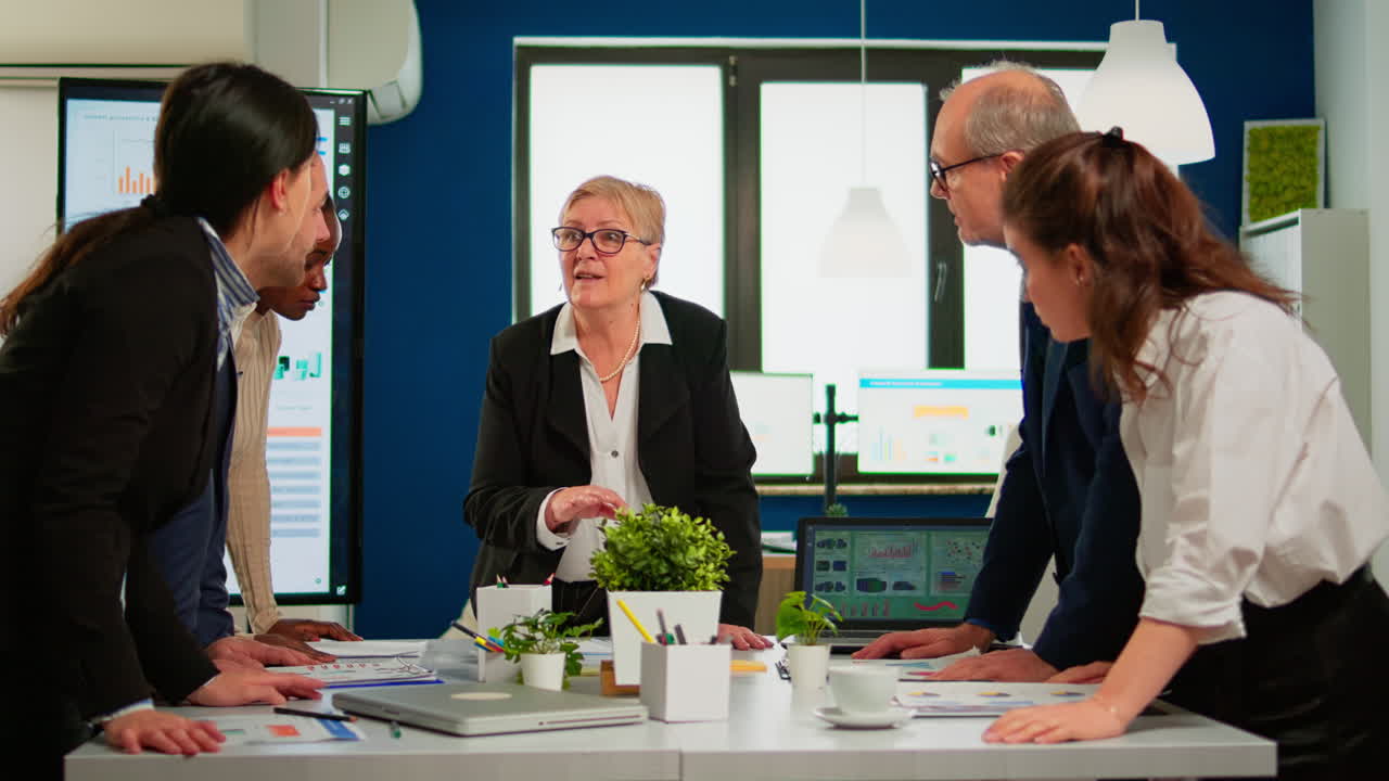 Group of diverse enthusiastic business people discussing project ideas
