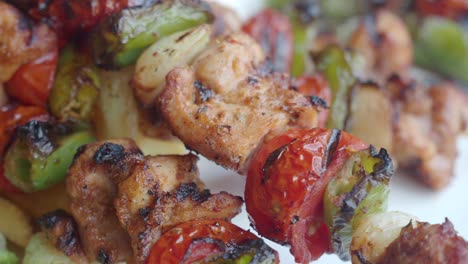 grilled chicken skewers with vegetables and fries