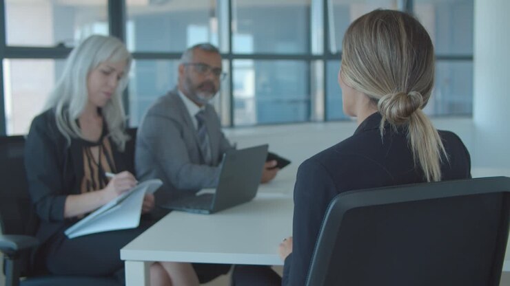 Female candidate meeting and talking to employer