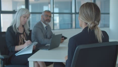 female candidate meeting and talking to employer