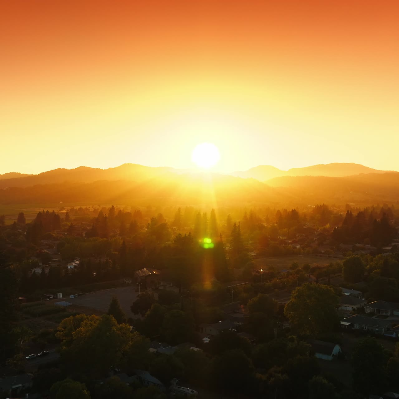 Beautiful green wine city of Napa, California, USA. Amazing sunset and pink sky over the cityscape. Top view