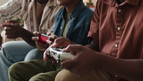 boy playing video games with family