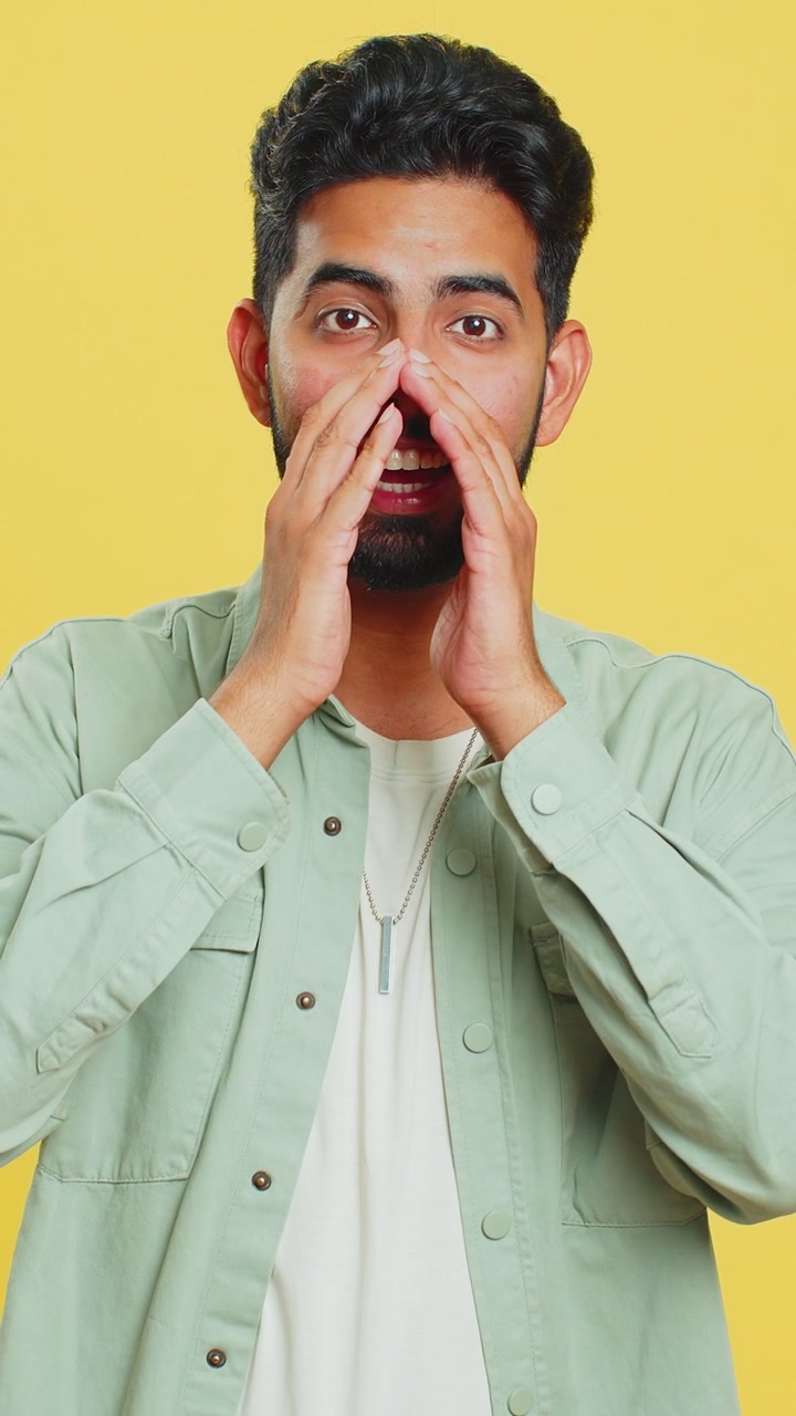Indian man yell shout scream loud to camera promotion advertisement sale invitation greetings