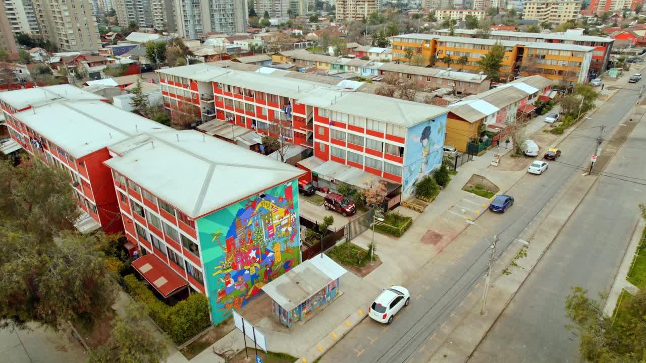 Drone shot in front of Mural art at the San Miguel open air museum, in Chile