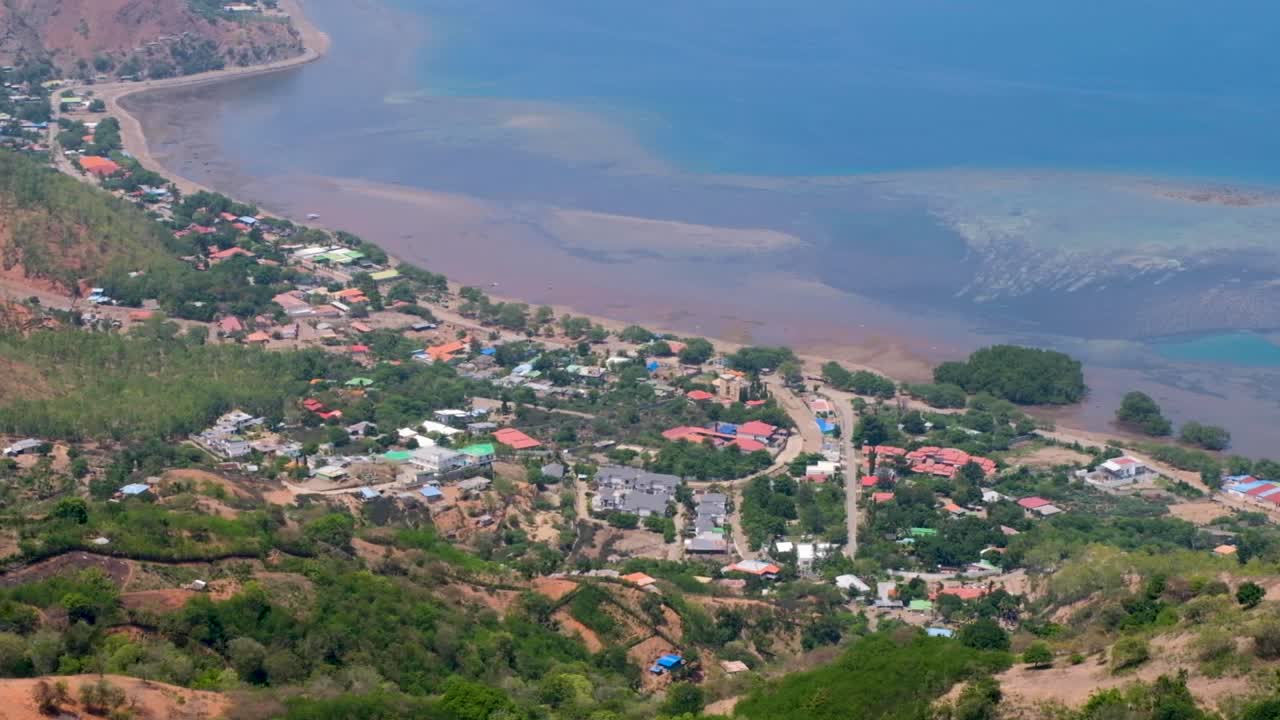 Scenic aerial landscape view of houses of local communities on the coast in Dili, Timor-Leste, Southeast Asia