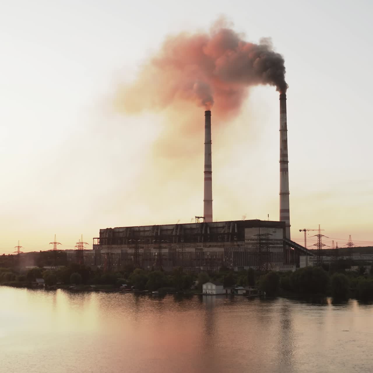 Industrial zone with large chimney. Aerial view of high smoke stack with smoke emission