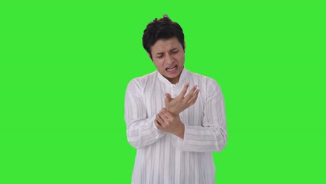 sick indian man suffering from hand pain green screen