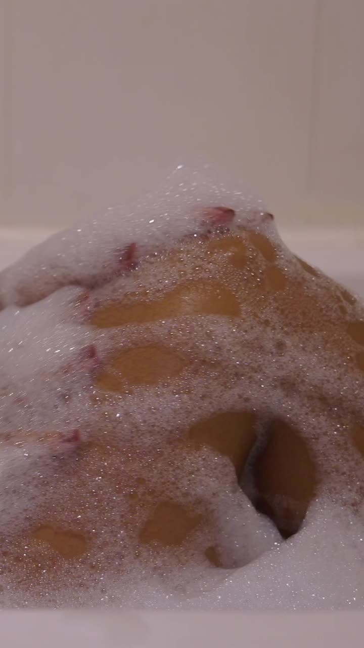 Woman relaxing in a bubble bath