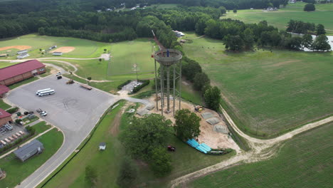Cinematic-tilting-downward-drone-shot-of-a-water-tower-under-construction
