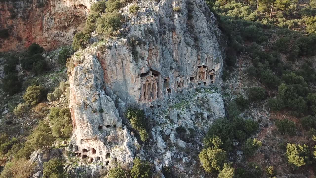 Drone picturesque view on Lycian Tombs in mountain in Dalyan, Turkey
