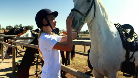 Girl-caressing-the-horse-in-the-ranch-4k