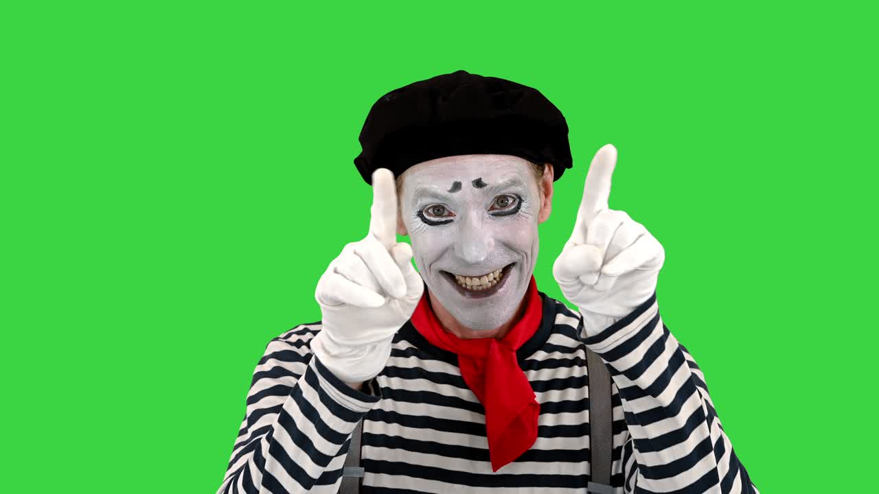 mime mostrando su amor a la cámara en una pantalla verde, llave de croma