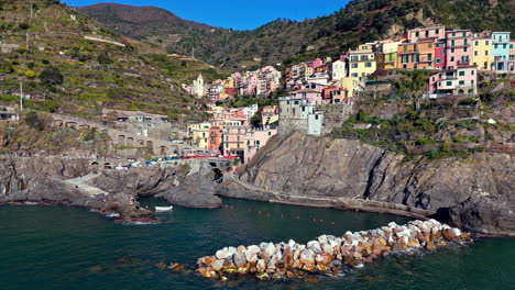 colorful coastal houses in manarola, cinque terre, italy, overlooking the water