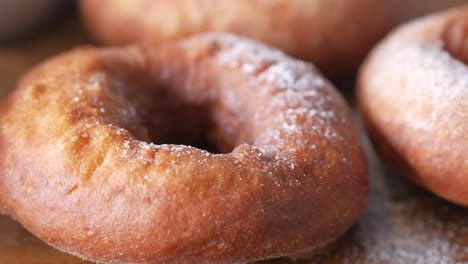 close up of powdered sugar donuts