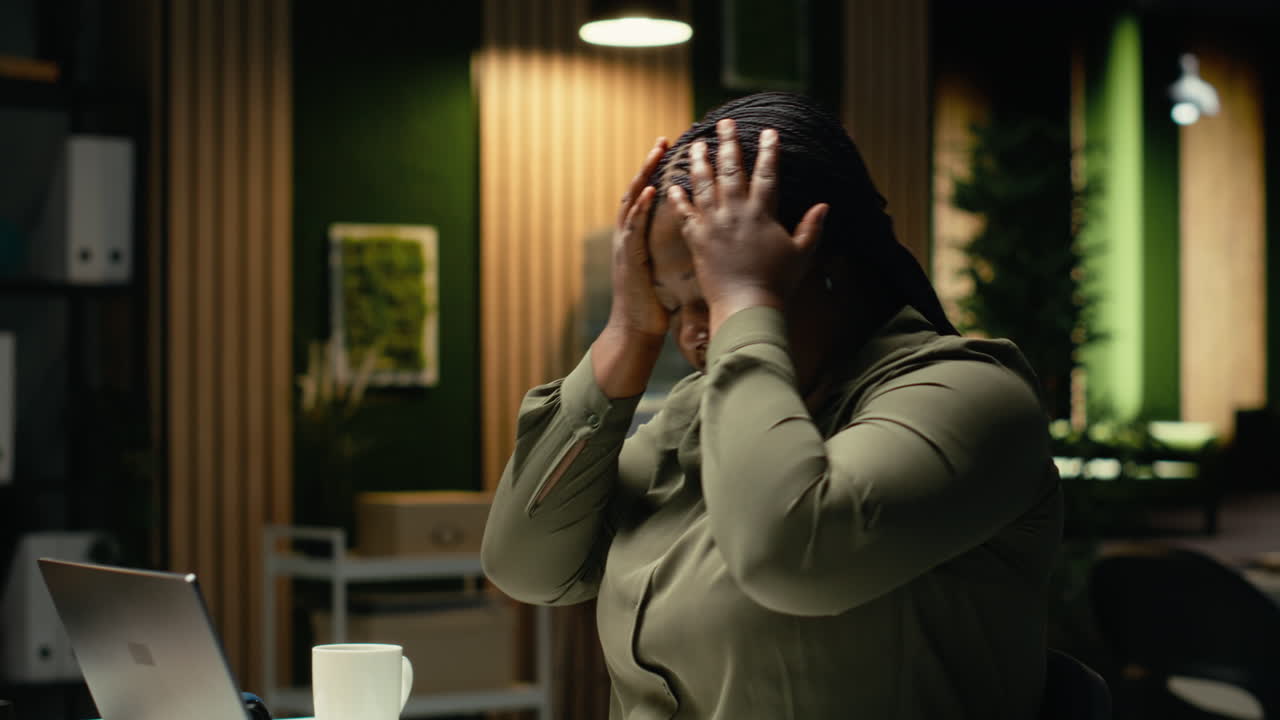 Female worker correcting pose and stretching her neck muscles