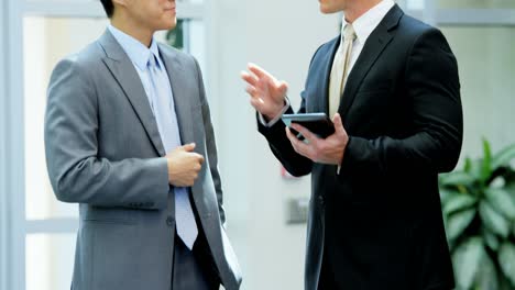 multi ethnic male female business team using technology