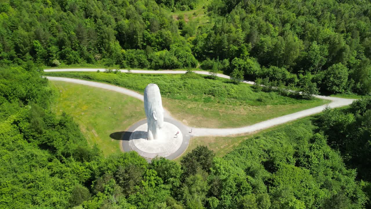 The mesmerizing Dream sculpture, St Helens - UK. Drone gimbal up and move out from close, revealing scenery