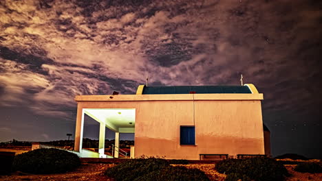 timelapse of cyprus chapel under a starry sky with cirrus clouds morphing, crafting a magical and surreal animation