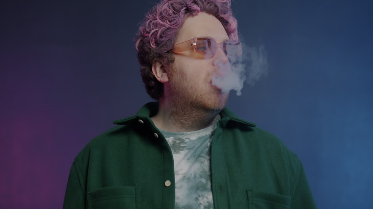 Stylish Man Exhaling Smoke