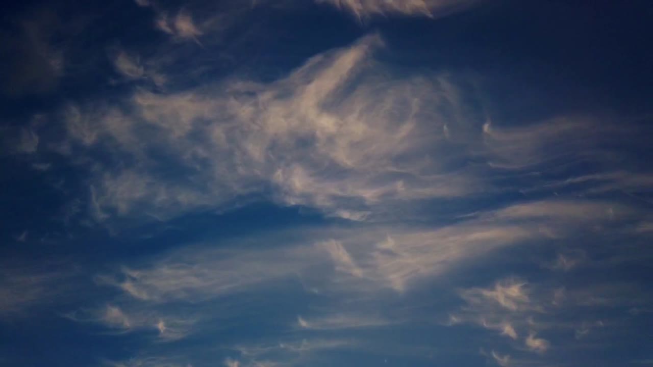 Beautiful clear blue sky turns dark soft cloud timelapse during sunset