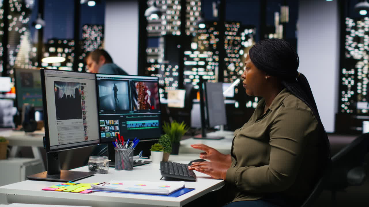 Woman video creator working on editing a movie montage project