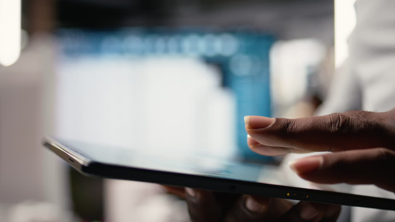 African american developer evaluating 3D models blueprints and digital software