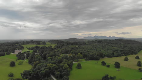 aerial footage of the picturesque landscape near the winterfell castle in northern ireland