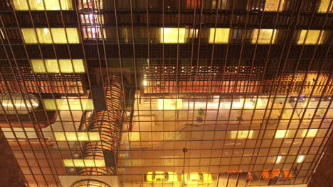 lights reflected in mirrored hotel building