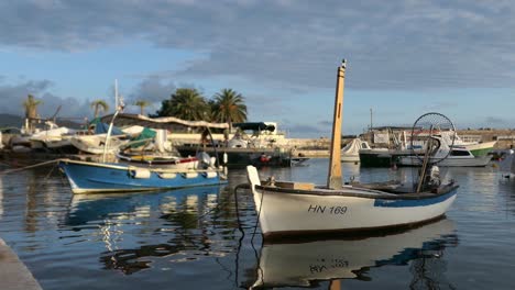 Fishing-boat-on-a-small-harbor-at-sunset,-Mediterranean,-Europe