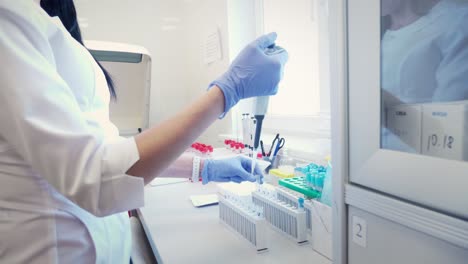 lab technician performing blood test