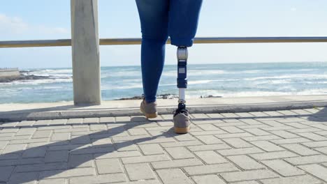 low section of disabled woman walking on promenade near railing 4k