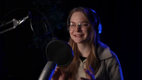 woman recording podcast in studio
