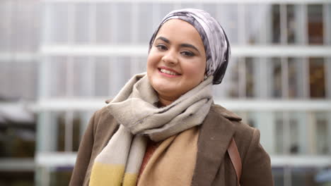 portrait of british muslim businesswoman outside office