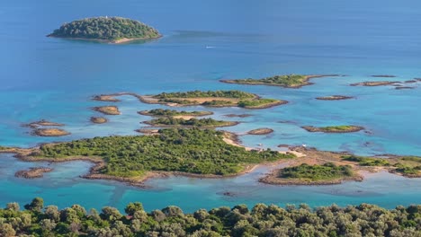 drone performs an orbit around the lush green oasis of lichadonisia islands, highlighting vibrant nature and clear blue waters by the sea