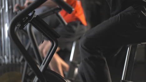 people exercising on machines at the gym